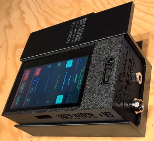 V3 touchscreen unit in caddy angled view showing screen and connectors